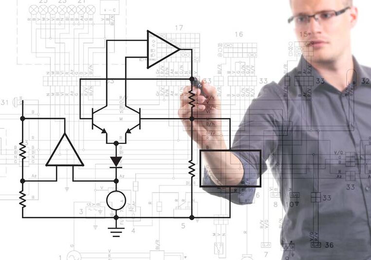 Electrical engineer drawing circuit diagram on the whiteboard