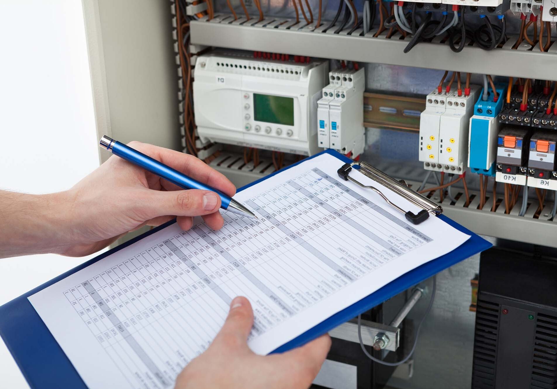 electrician testing a fuse box