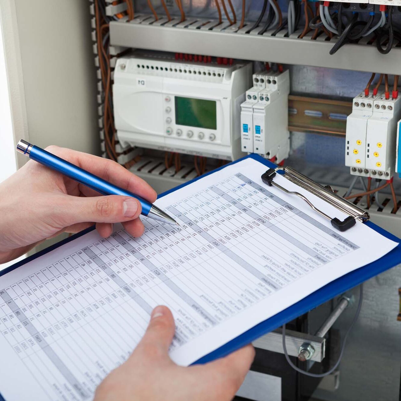 electrician testing a fuse box